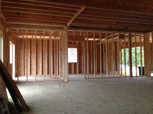 Looking from the family room toward the dining area on the left and kitchen to the right