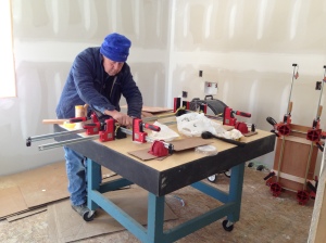Bill gluing and clamping up cabinet doors