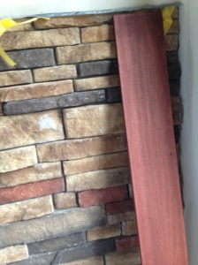 A piece of trim up against the stone of the fireplace. Matches really well.