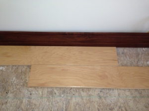 Hardwood floors next to floor boards