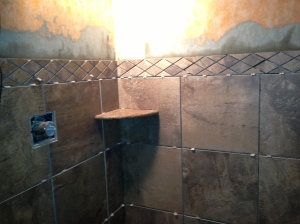 Decorative diamond shaped tile installed along with one of the corner shelves