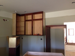 Three upper kitchen cabinets installed