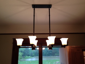 They used the bulbs we bought for the outdoor lights for the chandelier (we will replace with LED)