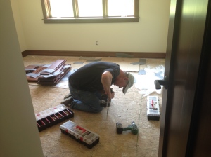 Bill trying to fix squeaks in bedroom floor